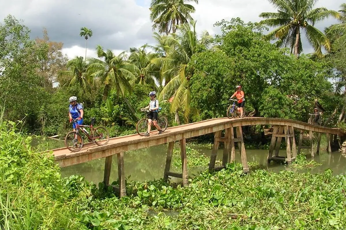 Liquid Gold and Green Labyrinths: Mekong Delta Bike Tour: Ride Along Canals, Orchards & Floating Markets